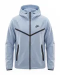 Nike Sportswear Demisezoninė striukė &scaron;viesiai mėlyna / juoda