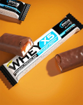 "Whey X5 Protein Bar" Baltymų Batonėlis 'Genius Nutrition' (48g) - Roasted Coconut Milk Chocolate