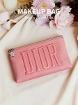 DIOR 1 vnt. Rožinė užtrauktuku užsegama makiažo priemonėms laikyti su įspaustais DIOR raidžių ir žvaigždės pakabuku Ne&scaron;iojama kosmetikos dėklė moterims kelionėms ir kasdieniam naudojimui rožinė