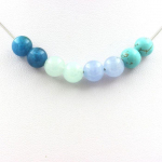 Pierres et Min&eacute;raux. Collier perles Ang&eacute;lite + Aigue-marine + Turquoise + Apatite 8 mm Chaine en acier inoxydable.