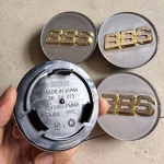 4 vnt. 70 mm BBS emblema Balta auksinė Automobilio ratlankio centrinis dangtelis Stebulės BBS centriniai dangteliai Logotipai 56.24.120 56.24.073 Priedai