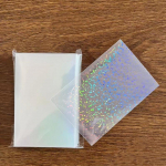 50 vnt./stal. Permatomos kortelių rankovės 5,7x8,6 cm Little Stars lazeriu mirksinčios kortelės rankovės, apsauginės kortelės laikiklis, apsauginė plėvelė 65*90mm
