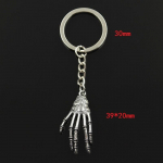 Madingas 30 mm raktų pakabukas Metalinis raktų pakabukas Raktų pakabukas Juvelyriniai dirbiniai Antikvariniai sidabro spalvos dengti skeleto kaukolės nagai 39x20 mm pakabukas
