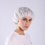 &bdquo;Bouffant Cap&ldquo; plaukų tinkleliai, balta dėžutė, 100 vnt., neaustinė apvali kepuraitė balta