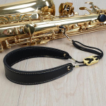 Reguliuojamas saksofono kaklo pamink&scaron;tintas odinis dirželis Sax Harness pakabinamas diržas