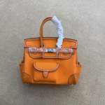 Naujas 25 cm &bdquo;Cargo-Swift&ldquo; odinis krep&scaron;ys su drobės ki&scaron;ene ir odiniu dirželiu per petį. 25cm oranžinė