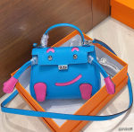 Auk&scaron;čiausios kokybės vir&scaron;utinio sluoksnio karvės odos millennial lėlės &scaron;ypsenos veido rankinė mini rankinė nauja moteri&scaron;ka rankinė per petį crossbody rankinė 16*6*14cm