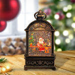 Kalėdinis žibintas su muzika, sniego gaublys, dovana, ap&scaron;viestas Santa Claus