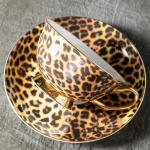 Madingi leopardo ra&scaron;to kavos puodeliai, lengvi, prabangūs, auk&scaron;tos klasės popietės arbatos puodeliai ir lėk&scaron;tės, buitinis subtilus keraminis pieno puodelis