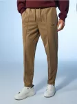 Sinsay - Tapered fit kelnės - kūno spalva