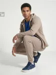 Sinsay - Tapered fit kelnės SNSY PERFORMANCE - kūno spalva