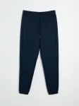 Sinsay - Tapered fit kelnės Active - tamsiai mėlyna