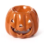 Keraminis aliejaus degiklis, pagamintas moliūgo &bdquo;Jack O&rsquo;Lantern&ldquo; formos