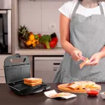 Sumu&scaron;tinių skrudintuvas Black & Decker BXSA753E &mdash; 2 sumu&scaron;tiniams, 750 W, nelipnios plok&scaron;tės, 215&times;125 mm kepimo pavir&scaron;ius, kompakti&scaron;kas nerūdijantis plienas