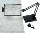 Table-top magnifier mounted on the tabletop