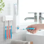 Dantų pastos dozatorius su dantų &scaron;epetėlių laikikliu Diseeth InnovaGoods