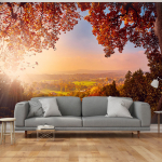 Fototapetas Artgeist Autumn delight - sunny landscape with countryside surrounded by trees and fields, 70 cm x 100 cm